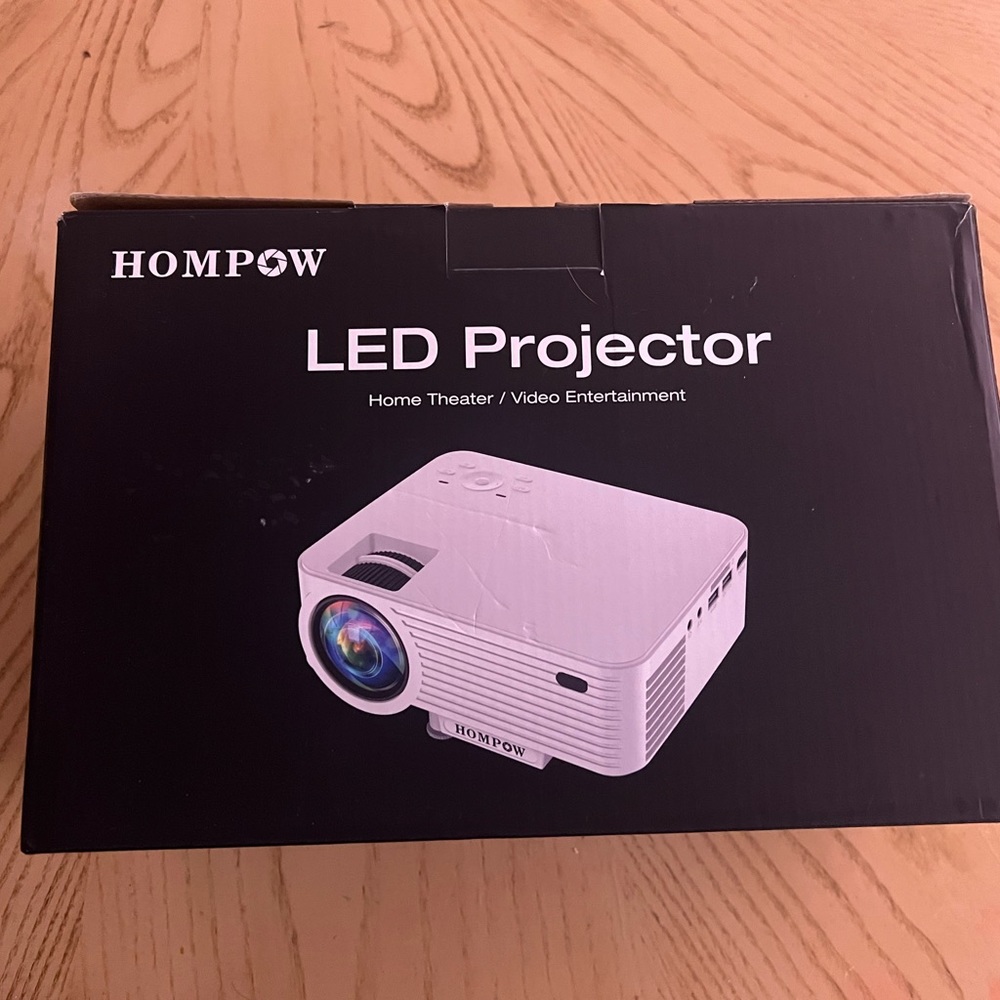 LED home projector. With cables and remotes included. Never been used